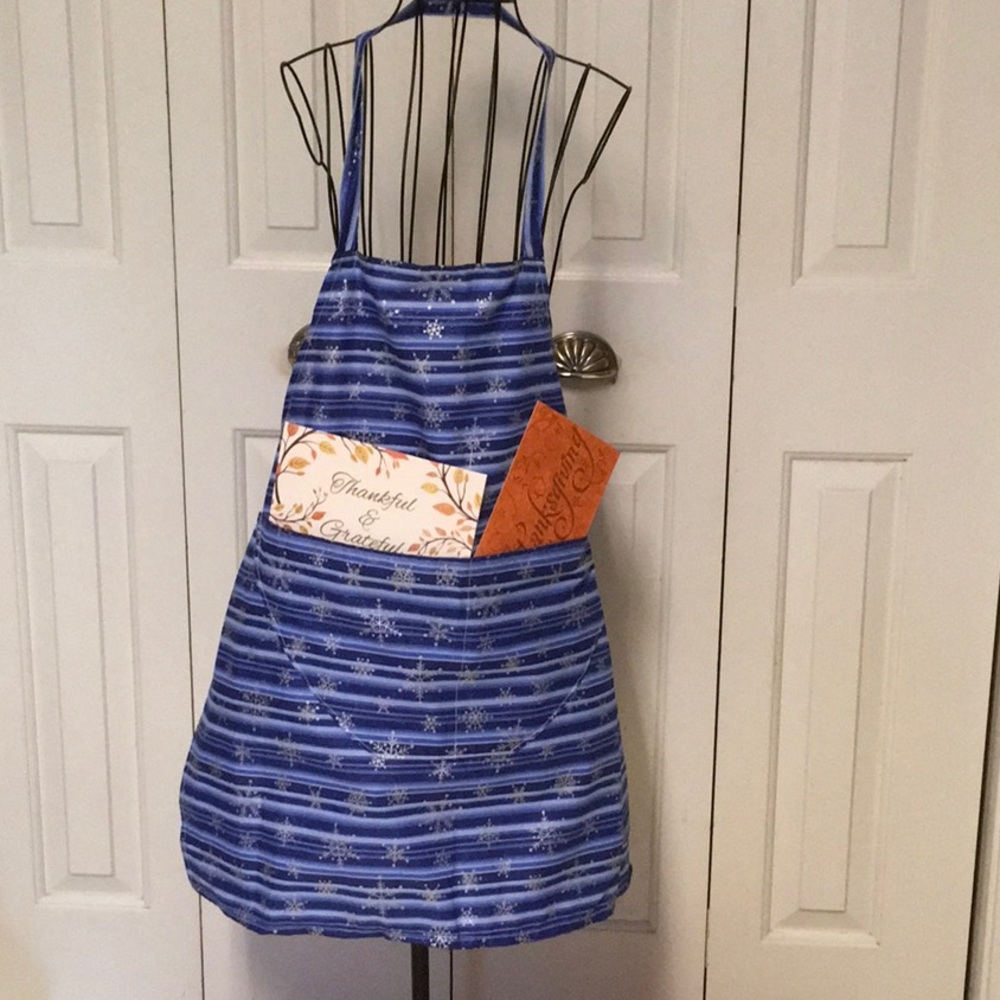 Christmas apron, blue and silver around neck And tie in back.